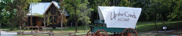 Covered Wagon At Up The Creek Campsite Entrance