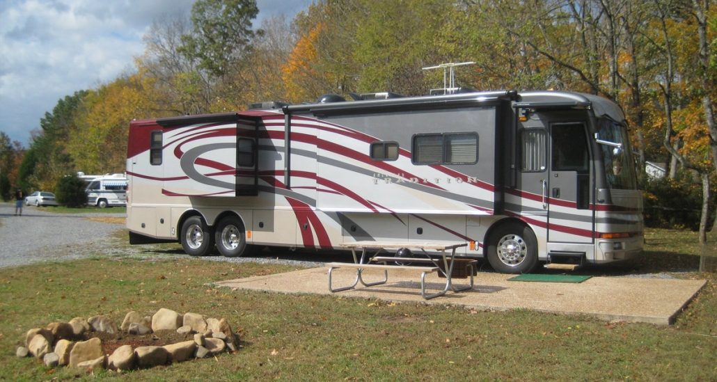 RV Parked At An Up The Creek Site By A Firepit